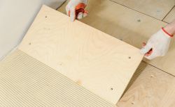 Laying down a wooden plyboard subfloor